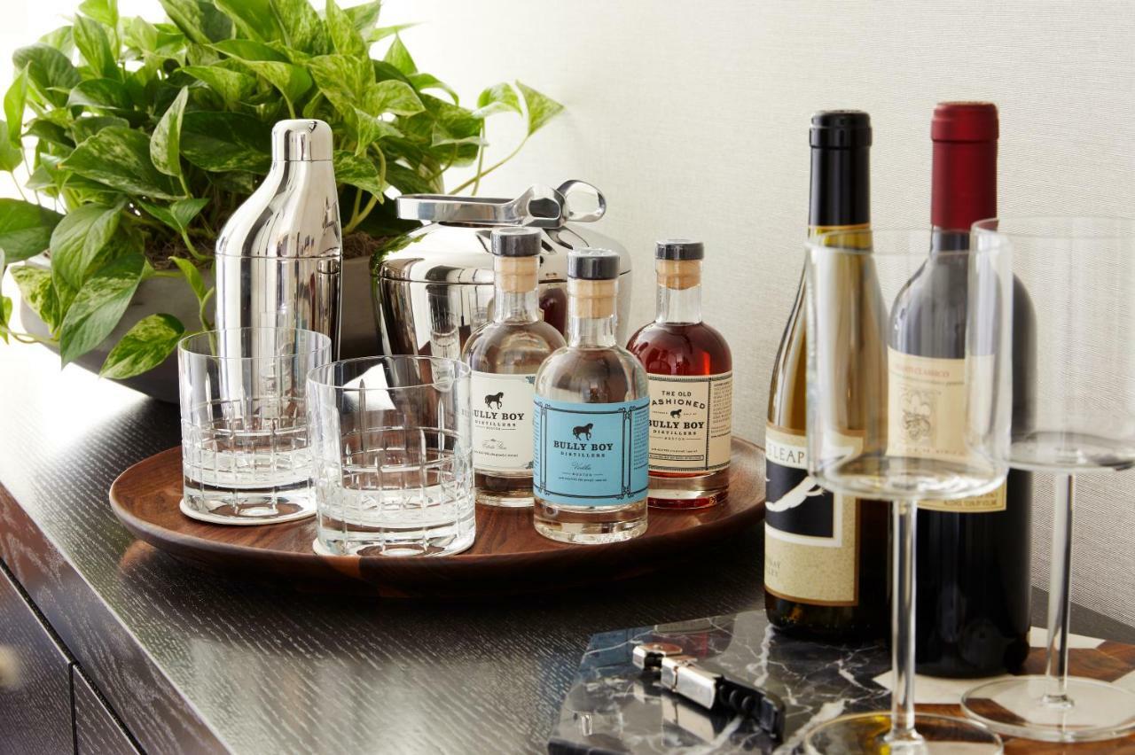 The Whitney Hotel Boston Esterno foto A bar cart with a selection of liquor and wine
